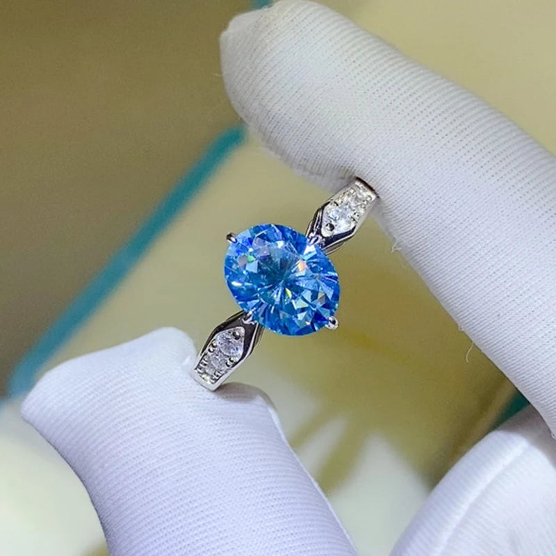 Anillo de moissanita ovalada de color azul fantasía con zafiro 