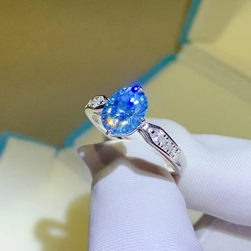 Anillo de moissanita ovalada de color azul fantasía con zafiro 